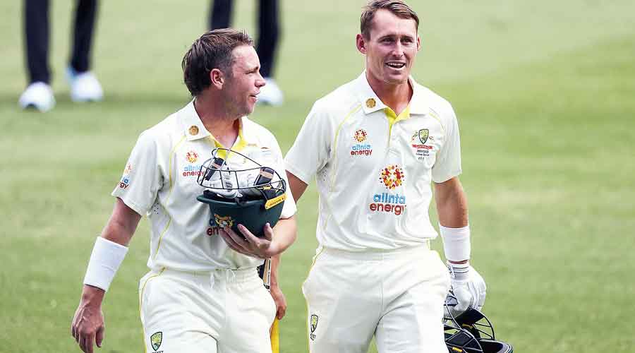 Australia’s Marcus Harris and (right) Marnus Labuschagne after winning the Gabba Test on Saturday.