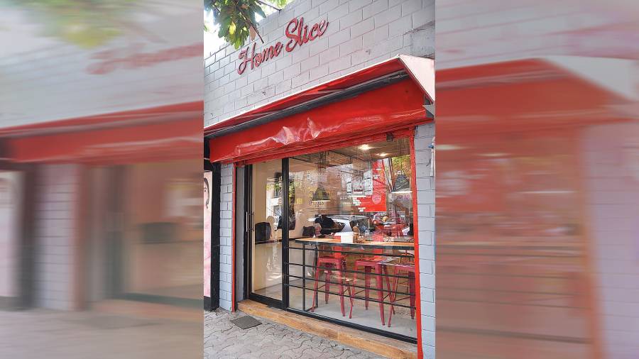 The new Wood Street outlet is done up in bright red and complemented with muted tones of grey and white.