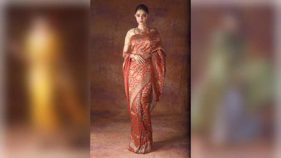 The quintessential occasion and festive colour palette of red and gold is translated here on silk with Tibetan art and cultural motifs, draped in a contemporary manner. “In Tibetan culture, the colour red is very prominent along with gold. I have added a dash of blue to enhance the look. The motifs are inspired from the paintings and sculpting on the pillars and walls of the monasteries in Ladakh,” added Pinki