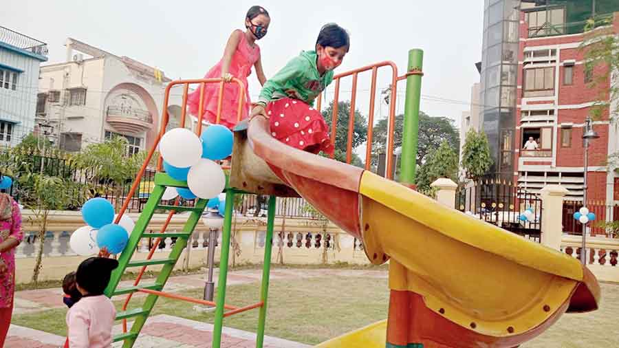 Children play in the newly inaugurated park near Tank 9 with equipment for those aged under 10.