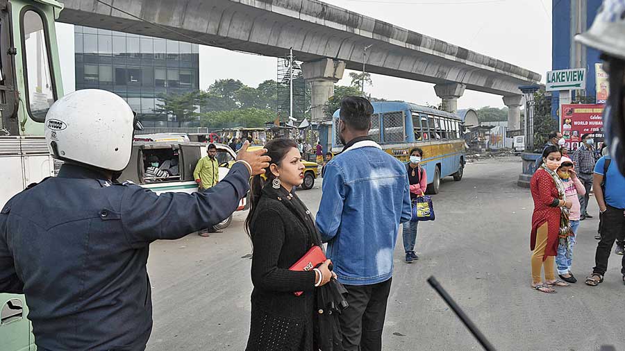 Parama flyover. A policeman directs pedestrians towards the subway near the Parama rotary on EM Bypass.