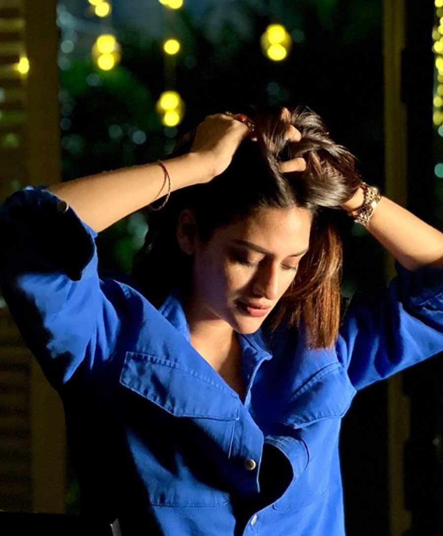 KILLING IT SOFTLY: Actor-turned-politician Nusrat Jahan sports a blue shirt in a casual look. The actor posted this photograph on her Instagram handle on Tuesday, December 14, with the caption, “Feelin’ Blue??!!!!”