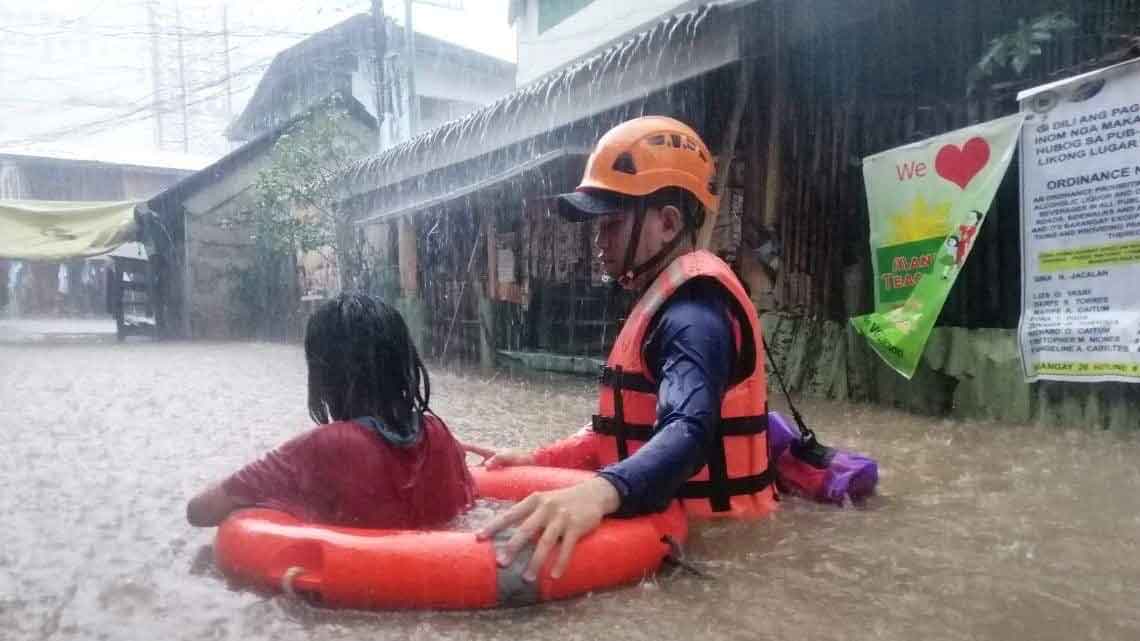 A child being rescued amid the storm