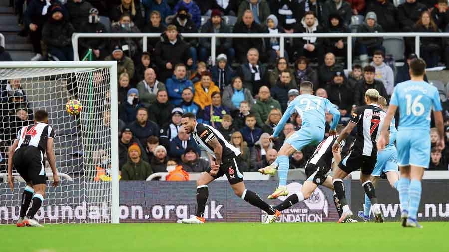 Joao Cancelo (jersey No. 27) scores Man City’s 2nd goal against Newcastle United during a Premier League match at St James Park on Sunday.
