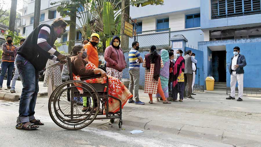 A queue of voters outside a polling booth in New Alipore on Sunday.