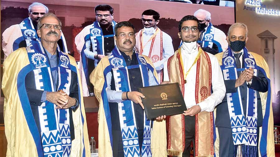 Union education minister Dharmendra Pradhan (second from left) hands over a degree certificate to a graduating student during the IIT Kharagpur convocation on Saturday.