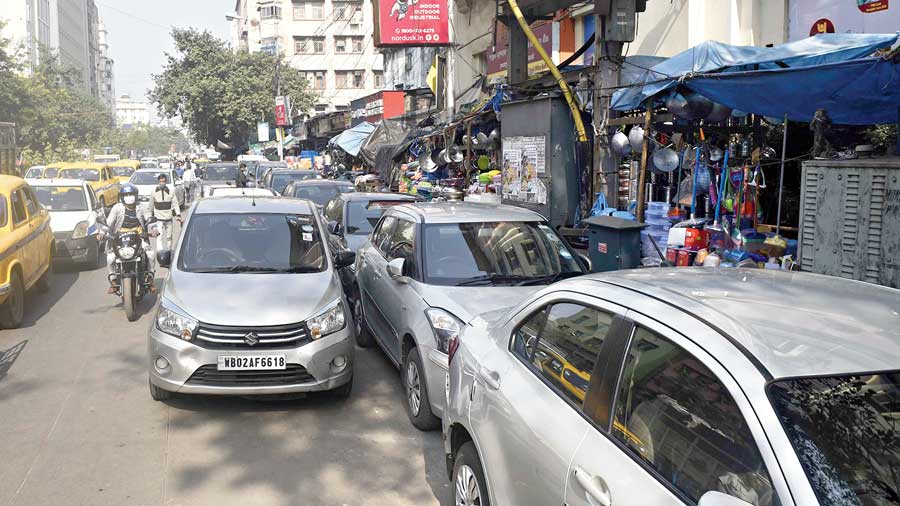 Cars parked along Brabourne Road in Burrabazar on Monday afternoon. 
