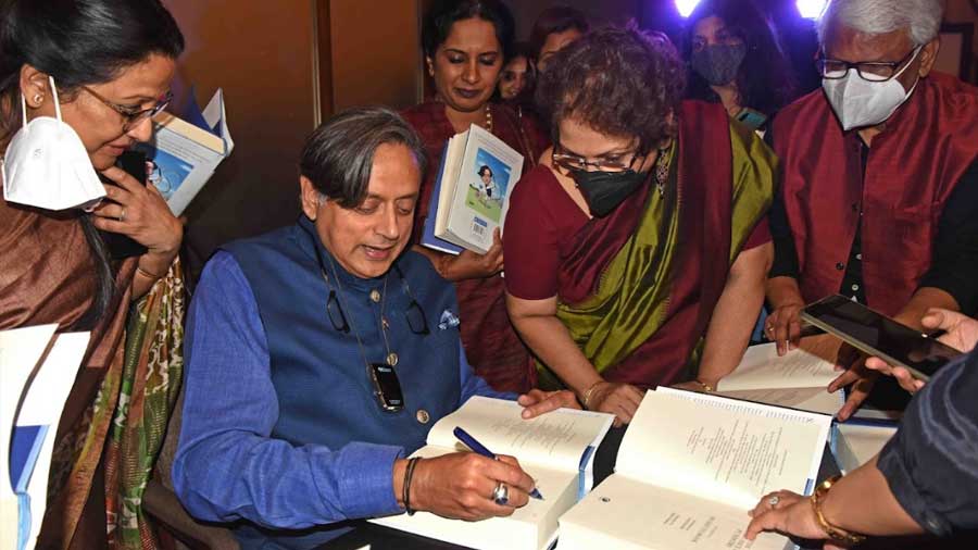 Tharoor is swarmed by admirers as he signs copies of his book