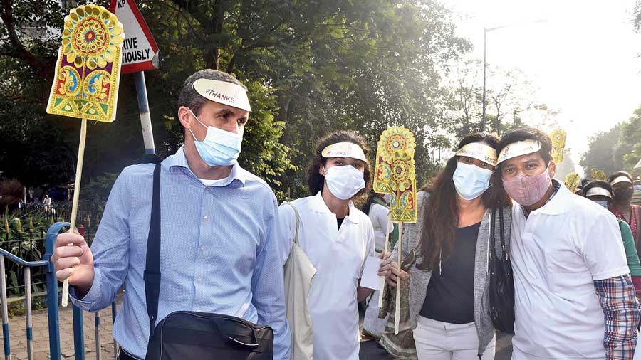 Flavia Boti (centre) of Argentina and her parents Hamid and Liliam at the rally. “We are visiting for a week. I follow Unesco on Twitter and read the news there. We heard of this rally at the Academy of Fine Arts on Monday,” said Flavia. “We have been to so many Unesco heritage sites. We must  return for Durga Puja,” Liliam added. 