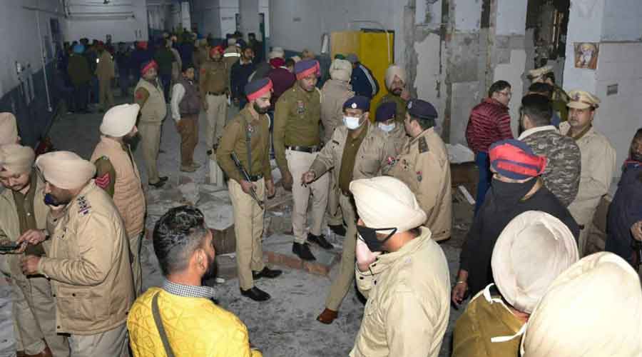 Police inspect the site of an explosion at the District Court complex, in Ludhiana, on Thursday.