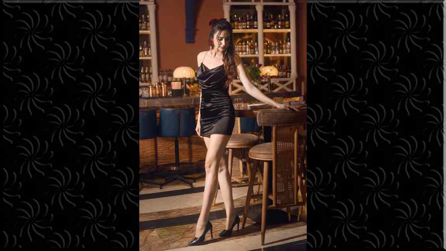 This one had ‘party’ written all over it. Jessica picked this for a night of clubbing on December 25. Red lips, black smokey eyes and a red bow completed the look.