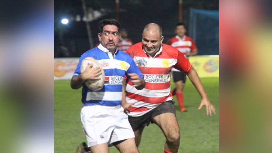 Nicholas Menezes (right) in a different kind of red-and-white attire