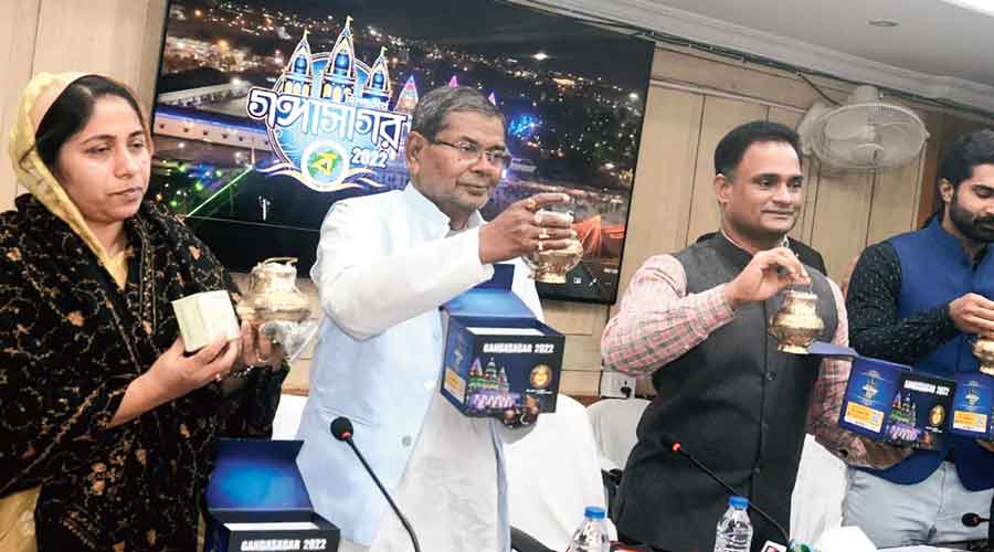 South 24-Parganas district magistrate P Ulaganathan (right) launches the eSnan pack on Thursday. 