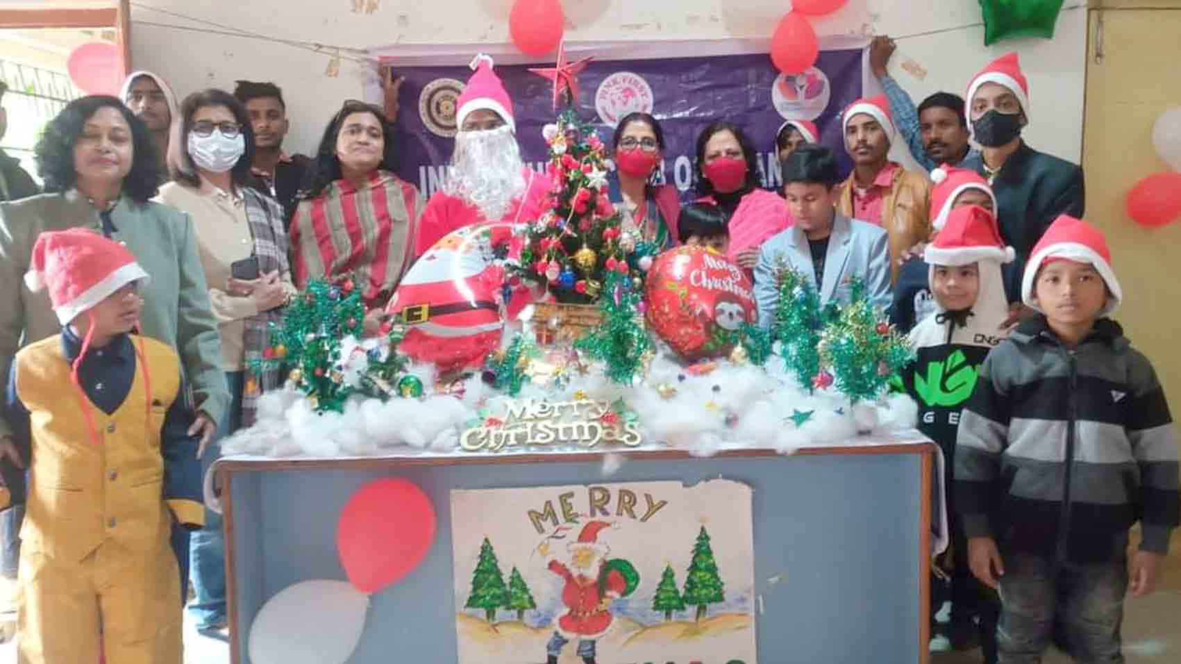 Children with their teachers celebrating Christmas