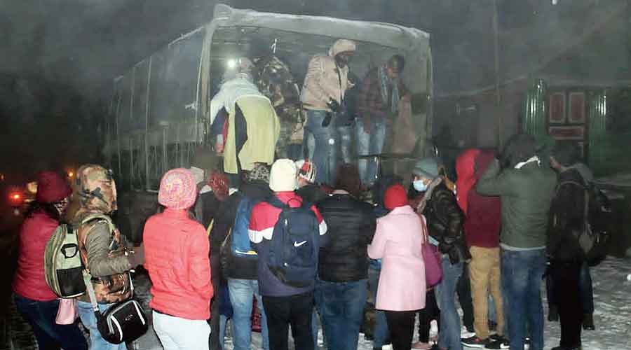 Rescued tourists board an army vehicle in East Sikkim near  the Chhangu Lake on Saturday evening.