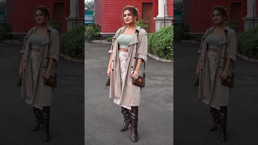 We loved how Ashna Malpani kept her winter look casual in an overcoat complemented with a pastel-shaded top and a floral-printed skirt. The high boots completed the look.