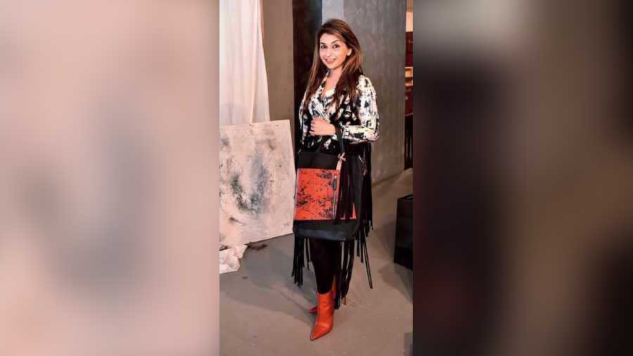 We caught Mehek Talreja busy shopping but there was no missing her style game. Black pants teamed with red ankle boots, and that fringe jacket from her label, the designer hit bullseye with her winter fashion game.