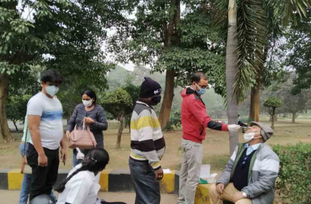 A couple of visitors undergoing Covid test by district health department officials at Jubilee Park on Monday
