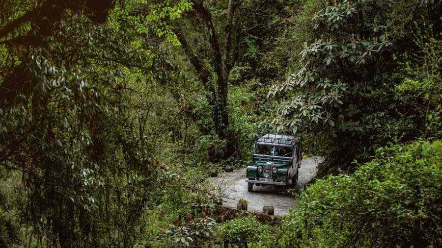 A Land Rover drives up from Manebhanjan