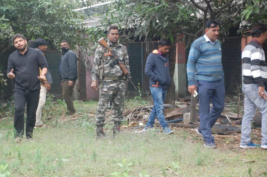 NIA officials outside Upendra Singh's house at Bhuli, Dhanbad on Wednesday