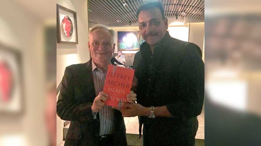 Archer, a serious cricket fan, feels the beleaguered England team might 'need me at the moment'. Above, Archer with former India cricketer and coach Ravi Shastri