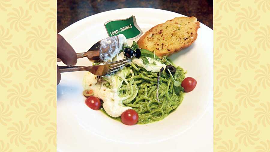 Pesto Pasta with Burrata: Dig into this creamy pasta that is served with a helping of burrata cheese. Rs 475