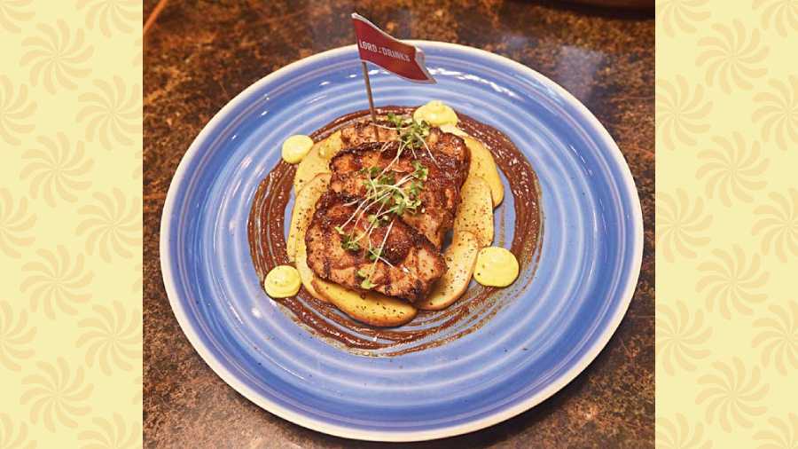 Belgian Pork Ribs: These chewy pork belly pieces are cooked to perfection and served with the chef’s special sauce, which adds just the right amount of sweetness to the dish. Rs 1,195