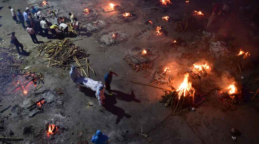 Mass cremation of Covid victims at a crematorium in New Delhi.