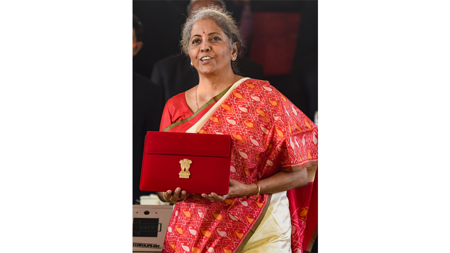 Finance Minister Nirmala Sitharaman holds a case containing a tablet device, during the Budget Session of the Parliament, at Parliament House in New Delhi, Monday, Feb. 1, 2021. 
