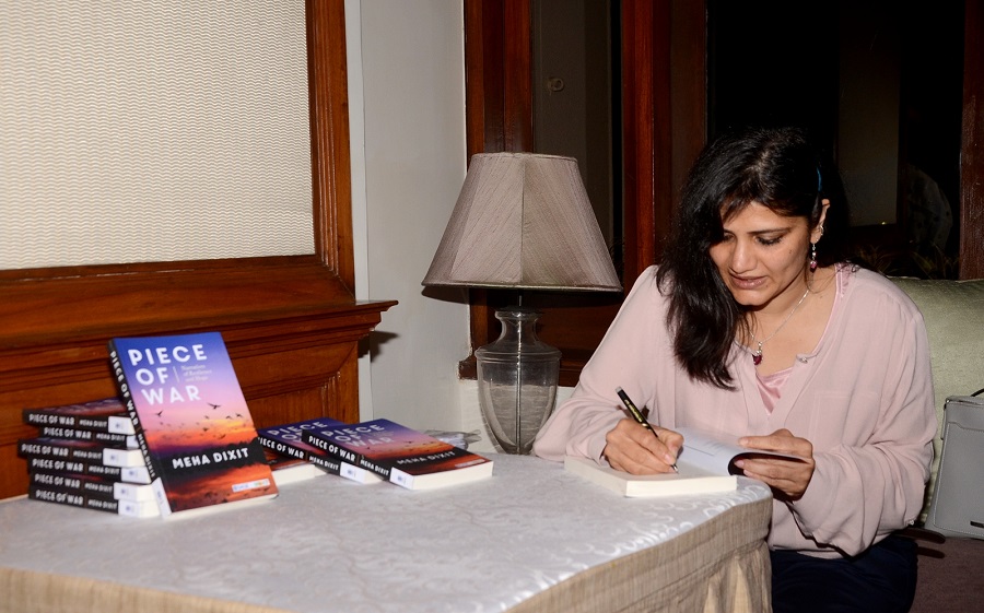 Meha Dixit signs copies of her book for the audience