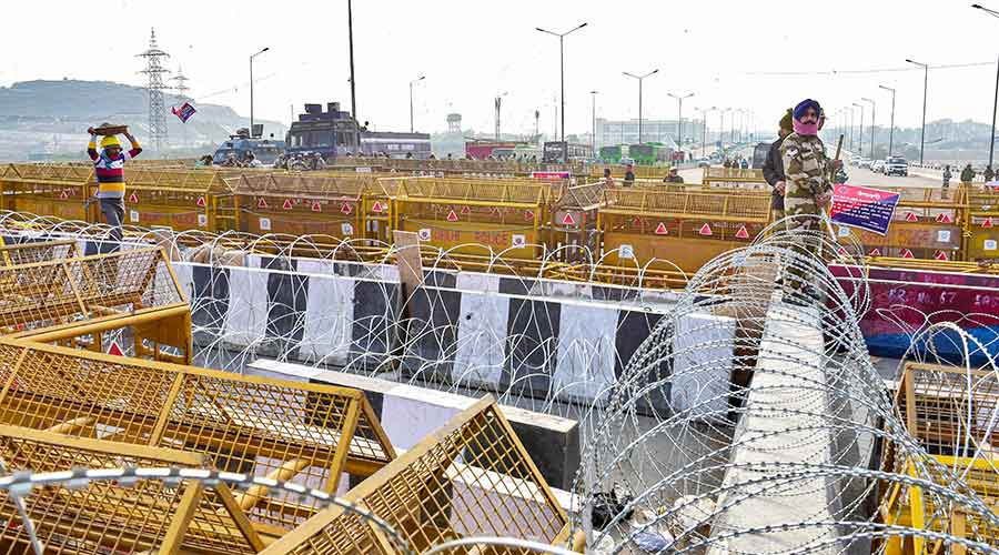 Police barricading at Ghazipur Border to stop farmers from entering the national capital during their protest against the new farm law, in New Delhi on Thursday, Feb. 4, 2021.