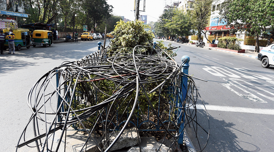 Defunct snipped cables on the median divider near Acropolis Mall on Thursday.