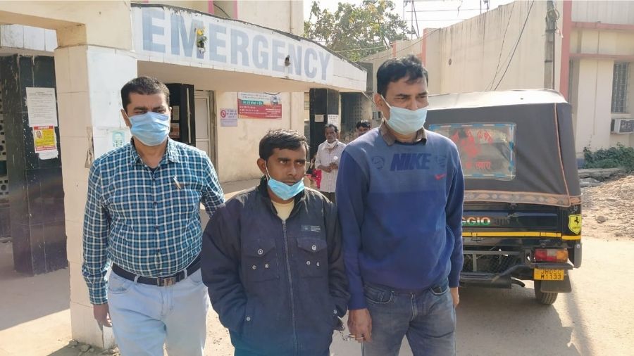 Flanked by two CBI officials, accused Kamlesh Pal is escorted out of the MGM Medical College Hospital after a mandatory post-arrest check up on Friday.