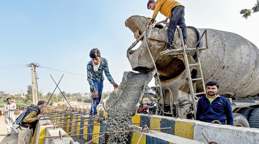 A concrete barricade under construction at Delhi’s  Singhu border on Friday. 