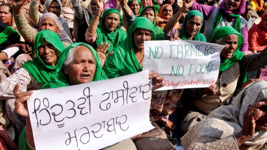 Women stage protest during the 'chakka jam' demonstartion at Dhareri Jattan Toll Plaza, on Saturday.