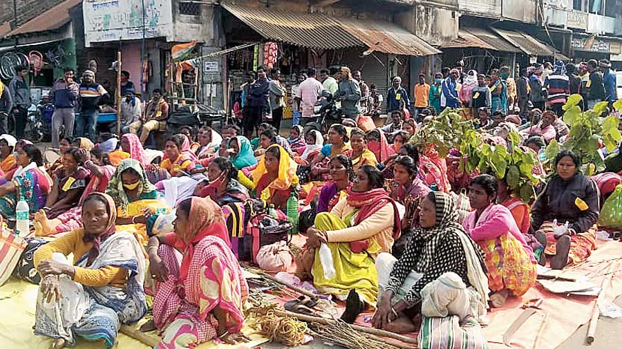 Tribal protesters block a road in Bankura’s Raipur on Sunday, alleging that the state transport department did not arrange enough buses to take them to a rally in Calcutta 