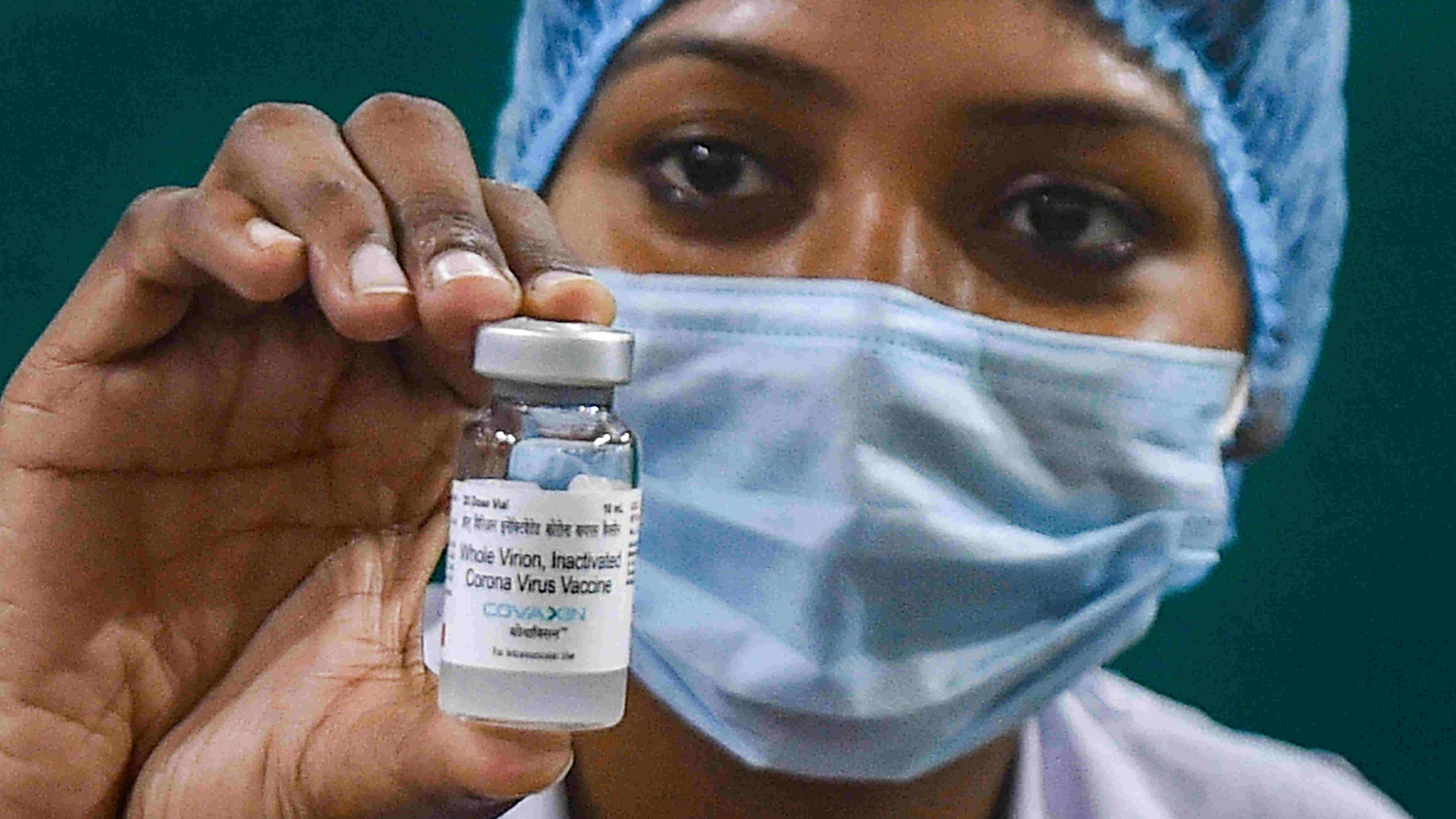 A medic shows a vial containing doses of Covaxin during a COVID-19 vaccination drive at a government hospital, in Kolkata, Wednesday, Feb. 3, 2021.