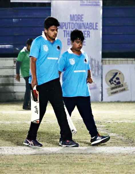 Yug Kaul and Ujan Ghosh of Destroyers confer during their partnership.