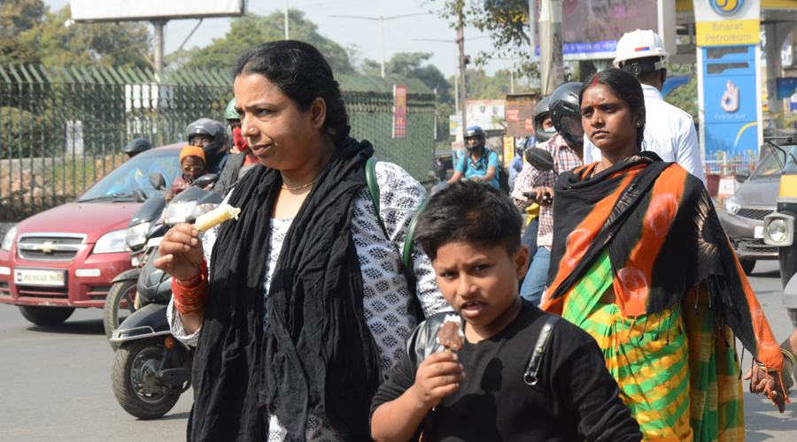 A mother and her son relishes ice-cream at Sakchi in Jamshedpur on Monday. 