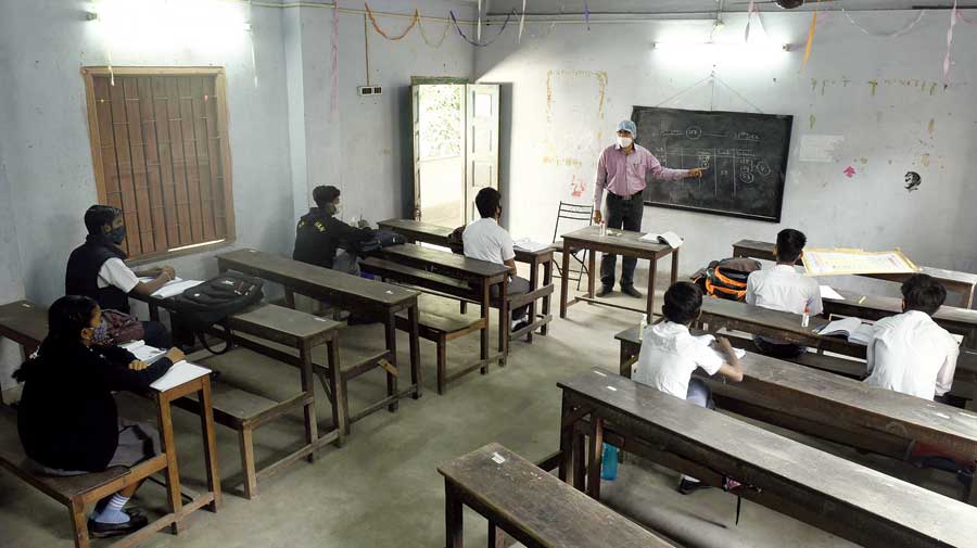 Students at a Jadavpur school attend class on Friday.