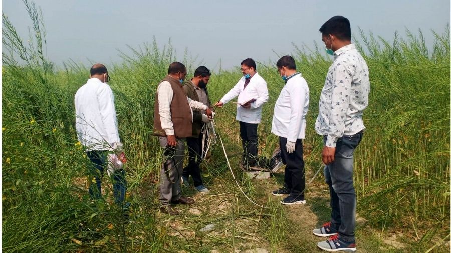 Officials investigate the site where the bodies of the girls were found in Unnao on Friday.