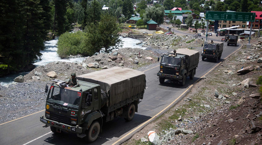 An Indian Army convoy moves on the Srinagar-Ladakh highway at Gagangeer, northeast of Srinagar.