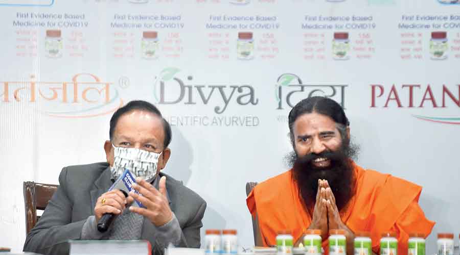 Union health minister Harsh Vardhan with Ramdev at the news conference in New Delhi on Friday