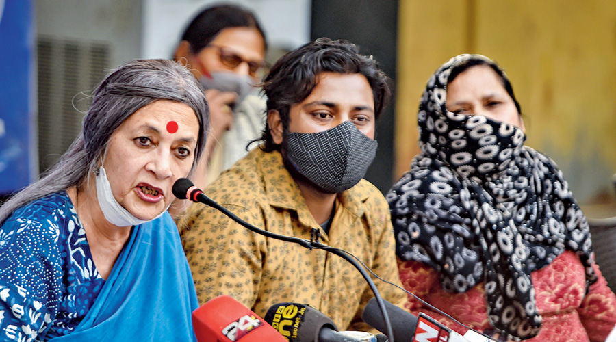 Mumtaj, who wants to name a BJP MLA in a riot FIR, with Brinda Karat at the news conference.