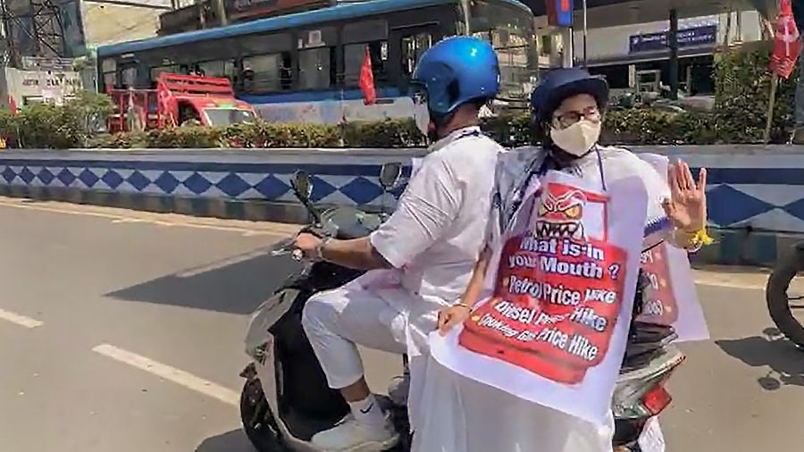    Mamata rides e-scooter to protest against fuel price hike