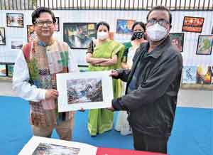 Hidco chairman Debashis Sen with a painting gifted to him at the inauguration of Art Street on February 16.