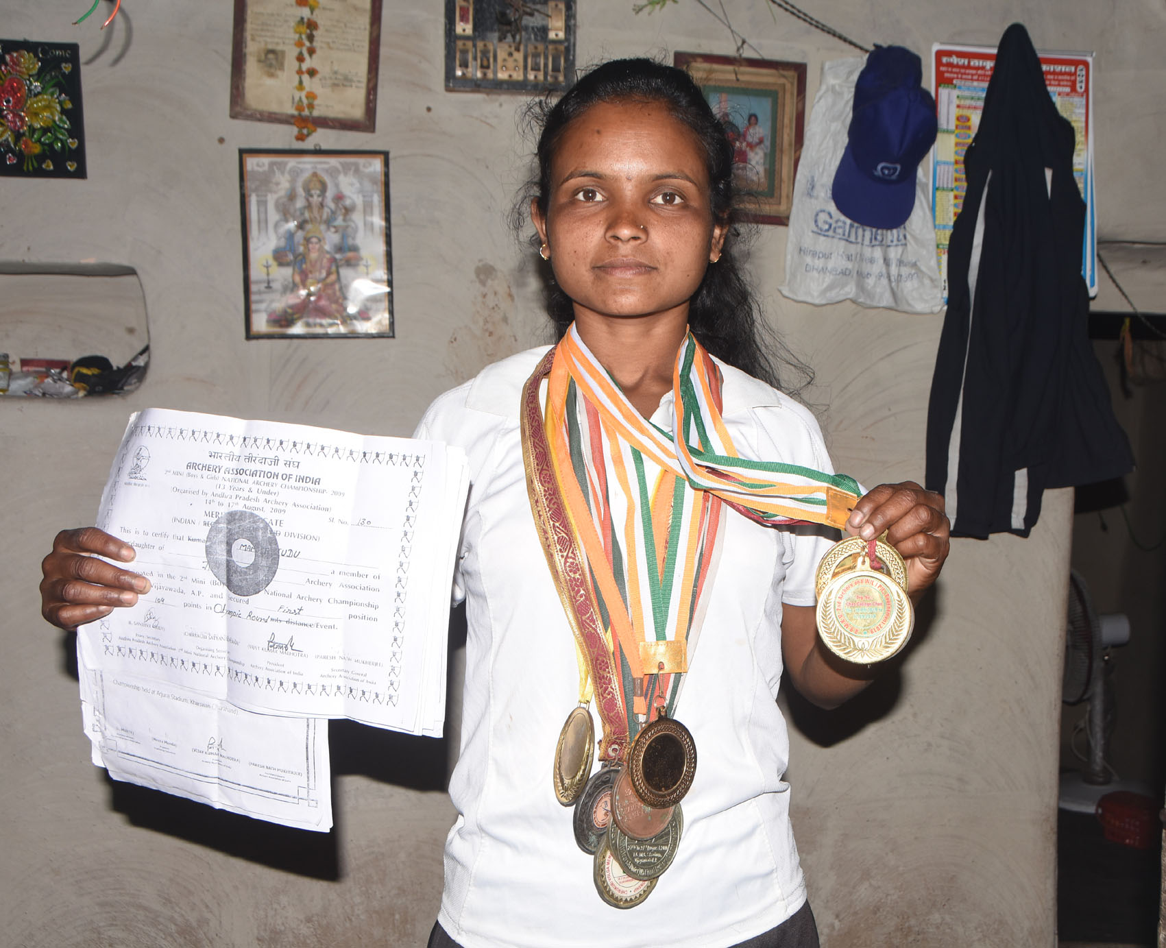 Mamta Tuddu with her medals and certificates.