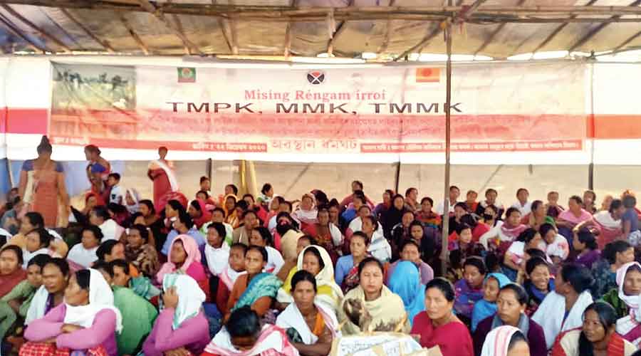 Villagers staging the sit-in at the protest site near the Tinsukia DC office