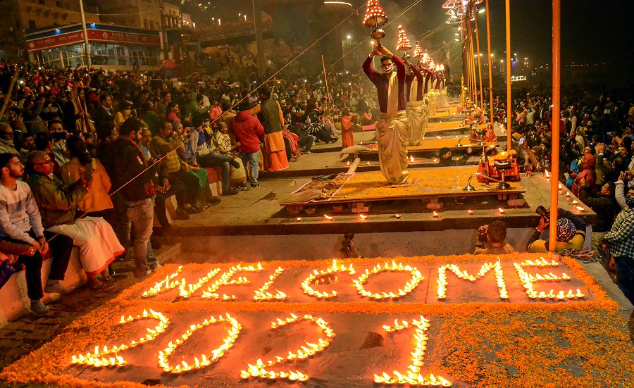 Priests perform Ganga Aarti as people prepare to welcome the New Year 2021, in Varanasi on Thursday.