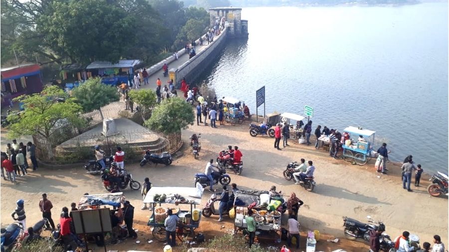 Visitors flock at ppular picnic spot Topchanchi Lake in Dhanbad on Friday.